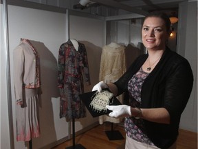 Christina Ryan/ Calgary Herald Airdrie, AB --JUNE 23, 2015 -- Curator Trisha Carleton shows off the Daring Deco: 1920 Women's Fashion. The exhibit explores the changing role of women through fashions, on June 22, 2015. (Christina Ryan/Calgary Herald) (For Entertainment story by Christina Ryan) 00066263A SLUG: 0624 Daring Deco 2