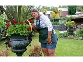 - Katrina Diebel, owner of Vale's Greenhouse, uses large containers planted with annuals to add a splash of colour to her gardens.