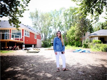 Leah Ramsay stands where her home used to be on the Banks of the Bow River in Bowness after it had to be demolished due to the damage caused by the floods of 2013.