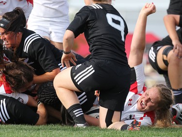 Team Canada's Olivia Demerchant pumps her fist as she scores a try against New Zealand in their Rugby Canada Super Series game at Calgary Rugby Park on Saturday June 27, 2015.