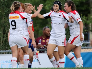 Team Canada celebrates scoring a try against New Zealand in the Rugby Canada Super Series at Calgary Rugby Park on Saturday June 27, 2015.