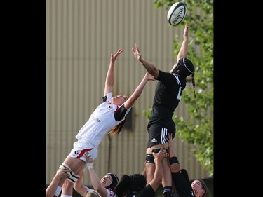 Team Canada and New Zealand reach for the ball in a line out during their Rugby Canada Super Series game at Calgary Rugby Park on Saturday June 27, 2015.