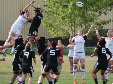 Team Canada and New Zealand reach for the ball in a line out during their Rugby Canada Super Series game at Calgary Rugby Park on Saturday June 27, 2015.