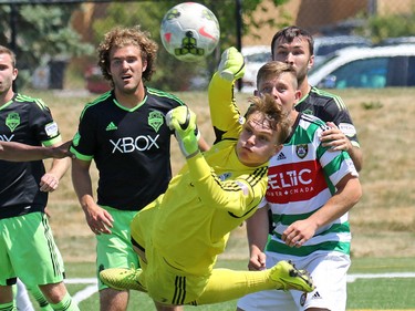 Seattle Sounders goal keeper Troy Perkins blocks a shot during a match against Calgary Foothills FC at Hellard Field on Sunday June 28, 2015.