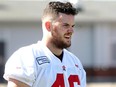 Canadian running back Charlie Power looks up during Calgary Stampeders practice at McMahon Stadium on Tuesday.