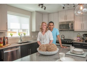 Charity and Andre in the Calbridge show home in Fireside, Cochrane.