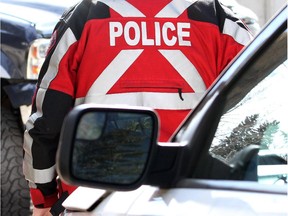 CALGARY, ALBERTA.:  MAY 07, 2013 -- STK. Police and car at crime scene stock image.  (Leah Hennel/Calgary Herald)