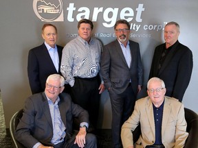 The partners of Target Realty, back row left to right,  Kenyon Chipman, Wayne Berry, Harvey Aronovich and Wayne Hill. Seated: Ralph Gibson, left, and Jim Duggan at their offices on June 3, 2015.