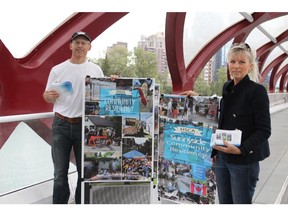 Michael Bradfield and Deborah Murray are handing out postcards asking the provincial government to do some flood mitigation work on the Bow River to protect downtown Calgary on Friday, June 19, 2015.