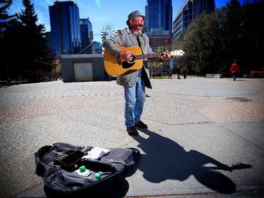 Perry Wilson, at his busking spot near Prince's Island Park where he regularly puts in full workdays and lives at  Calgary Drop-in and Rehab Centre.