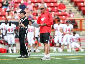 CALGARY, ; JUNE 7, 2015  --  Head coach John Hufnagel keeps a close watch on the action as the Calgary Stampeders hosted their training camp annual intra-squad game on Sunday, June 7, 2015 at McMahon Stadium. (Lorraine Hjalte/Calgary Herald) For Sports story by . Trax # 00065933A