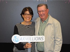 Carol and Bruce Rowe, of Beiseker, pose for this handout photo after winning $1 million in a lottery draw. The former Wildrose member of the legislature, , Bruce Rowe, who joined the Conservatives has won $1 million in the Lotto Max.