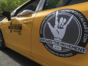 Empower the Movement decals on a Checker Yellow Cab in Calgary, on June 24, 2015. The decals are part of an anti-domestic violence campaign launched by Homefront Calgary.