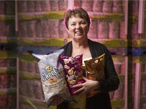 Elaine Cadrin, founder and owner of CheeCha Puffs, in front of pallets of puffs destined for eastern Canada Costco stores.