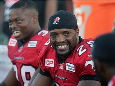 Calgary Stampeders Keon Raymond after catching a touch down against the Hamilton Tiger-Cats Johnny Sears Jr. during their season opener at McMahon Stadium, on June 26, 2015.