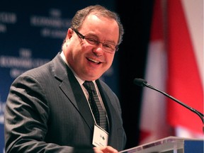 Saskatchewan Energy Minister Bill Boyd says oil and gas companies are redirecting spending to his province from Alberta because of the NDP royalty review following a speech in Calgary Wednesday.