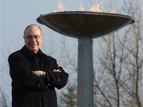 Frank King at the Olympic flame at Canada Olympic Park in Calgary, Feb. 10, 2009.