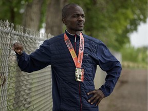 Daniel Kipkoech with his finishers medal prior to a training session in Lethbridge, Tuesday, June 2, 2015,. He was disqualified in last weekends' Scotiabank Calgary Marathon.  Kipkoech was on track for a  time that would have placed him second overall.    David Rossiter / Calgary Herald photo.