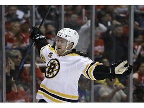 Boston Bruins defenseman Dougie Hamilton reacts after scoring during the first period of Game 3 of a first-round NHL hockey playoff series against the Detroit Red Wings in Detroit, Tuesday, April 22, 2014.