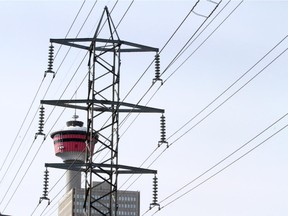 Downtown Calgary is framed by electrical power lines, in Calgary on March 19, 2014.