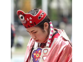 CALGARY, AB.; JUNE 15, 2015 -- Pikani Princess Macyn Morningbull listens during the opening ceremonies of Aboriginal Awareness Week at Olympic Plaza Monday June 15, 2015. (Ted Rhodes/Calgary Herald)