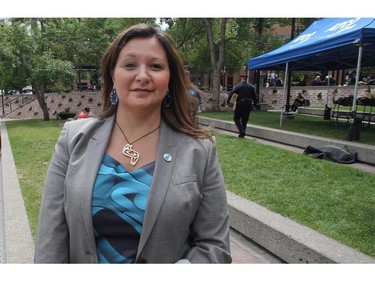 Organizer Monique Fry speaks to the Herald about the activities during the opening ceremonies of Aboriginal Awareness Week at Olympic Plaza Monday June 15, 2015. This year's theme is Keeping the Circle Strong, Honouring our Veterans and Elders. Saturday is the Family Day Festival Pow Wow at the Calgary Stampede Indian Village.