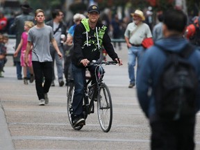 A cyclist uses the Stephen Avenue Mall cycle path on Thursday June 18, 2015. (Gavin Young/Calgary Herald)