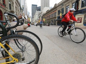 Cyclists use the Stephen Avenue Mall designated cycle track.