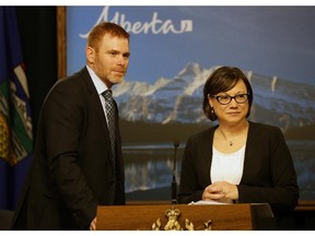 Alberta Environment Minister Shannon Phillips (right) with University of Alberta economist Andrew Leach, who is heading a review of the province's climate change policy.