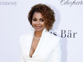 In this May 23, 2013 file photo, singer Janet Jackson arrives at amfAR Cinema Against AIDS benefit at the Hotel du Cap-Eden-Roc, during the 66th international film festival, in Cap d'Antibes, southern France. Janet Jackson is releasing her first album in seven years this fall. She also just announced an upcoming tour called the Unbreakable Tour, which will kick off in Vancouver before heading to Calgary for a Sept. 2 Saddledome show.
