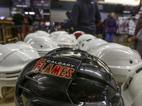 Shoppers check out used and discounted equipment at the annual Calgary Flames used equipment sale at the Scotiabank Saddledome.