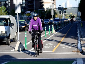 Bill Cozens uses the cycle track on his morning commute to work in Calgary on June 4, 2015.
