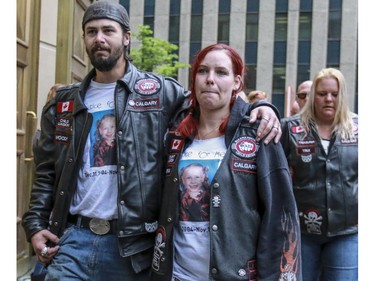 Kyla and Brian Woodhouse arrive at the courthouse with the Bikers Against Child Abuse to find out the final verdict in the Meika Jordan murder trial in Calgary, on June 3, 2015.