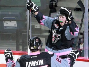 Calgary Hitmen defenceman Michael Zipp, right, seen celebrating a goal with teammate Connor Rankin last season, could be drafted into the NHL this weekend.