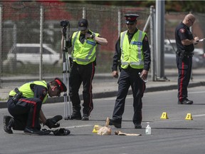 Police investigate a hit and run near the intersection of 16 Ave. and 17 St. N.W., June 7, 2015.