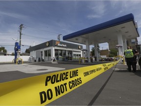 Police tape at a gas station at the intersection of 16 Ave. and 17 St. N.W., after a hit and run occurred just down the road from it on June 7, 2015.