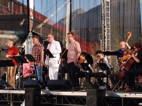 Art of Time Ensemble performed Abbey Road for an appreciative audience at The Banff Centre's Shaw Amphitheatre, Saturday June 27.
Front from left to right: singers Craig Northey, Jason Plumb, Steven Paige and Andy Maize.  Background:  bassist George Koller