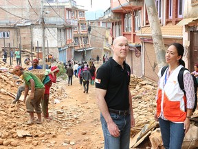 World Vision International president Kevin Jenkins (left) and World Vision Nepal National Director Liz Satow (right) survey the damage caused by the recent earthquakes to the community of Chautara in the Sindhupalchowk valley, which was close to the epicentre of the 7.8 magnitude earthquake that struck Nepal on April 25th.