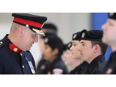 Calgary Police Chief Paul Cook inspects the graduates at the Auxilliary Cadet Graduation Ceremony at HMS Tecumseh Friday June 12, 2015. The Auxiliary Cadet program was started two years ago to help young people bridge into a career as police officers. Cadets mainly work at the front counters of Calgary Police Service offices to help the public with paperwork, filing reports and finding information.