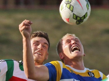 Kitsap Pumas forward Mike Chamberlain, right, and Calgary Foothills midfielder Tim Hickson go up to head the ball during game action at Hellard Field Thursday evening.