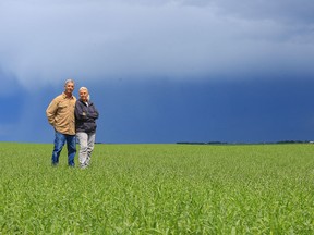 Keren Farquharson, right, and Louis Delgado, are photographed on their farm northwest of Calgary just outside Madden, Alta, June 19, after notifying authorities that they found one of the cows that graze their land, not only dead, but supposedly mutilated, in their pasture on June 6, 2015.