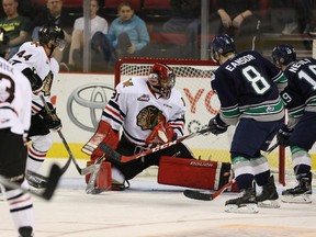 Calgary's Adin Hill, seen stopping the puck against the Seattle Thunderbirds during a WHL game last season, could be drafted as high as the second round.