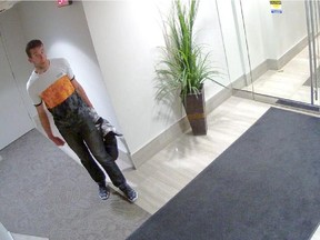 Police are searching for two men who allegedly broke into 25 storage lockers in southwest Calgary. (CCTV footage)