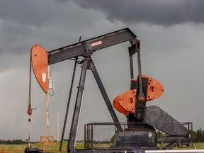Crystal Schick/ Calgary Herald CALGARY, AB STK -- An oil pumpjack or pumping unit is photographed in a field northwest of Calgary, on June 19, 2015. --  (Crystal Schick/Calgary Herald) (For City story by  STK)