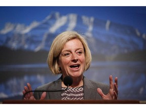 Alberta Premier Rachel Notley speaks to reporters about her first cabinet meeting in Calgary, Alta., Wednesday, May 27, 2015. Notley apologized Monday on behalf of Alberta to indigenous peoples for abuse in residential schools, and added her voice to an inquiry for missing and murdered aboriginal women.