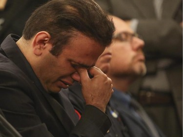 Ahmad Nourani Shallo, husband of Maryam Rashidi Ashtaini, who passed away on Tuesday, June 9, at the age of 35 from a hit and run which occurred just days earlier, breaks down as over 100 friends, family and supporters overflow the halls at Pierson's Funeral Services in Calgary, on June 12, 2015, to honour the life of his wife's life. She leaves behind her husband Ahmad Nourani Shallo and her 6-year-old son, Koroosh.