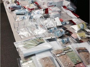 Red Deer RCMP seized more than 10,000 prescription pills and more than $15,000 cash from a Wells Street home on June 17, 2015.