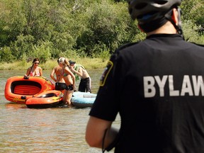 A group of rafters are forced off the Elbow river at Sandy Beach in August 2009 because they had no lifejackets.