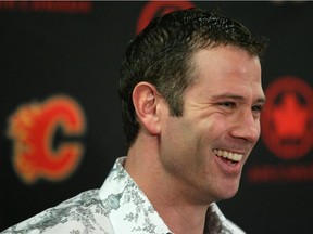 Craig Conroy, seen here at his retirement announcement in 2011, will be staying on as Flames assistant general manager after the team extended his contract.