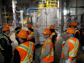 Visitors tour a carbon capture and storage facility at its official opening at the Boundary Dam Power Station in Estevan, Sask. on Thursday, October 2, 2014.